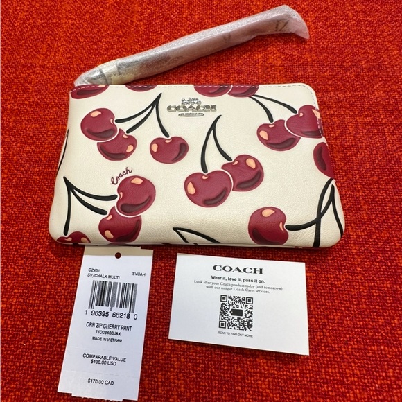 Coach Handbags - ❤️❤️❤️NEW Coach wristlet/wallet with cherry print /silvertone hardware ❤️❤️❤️
